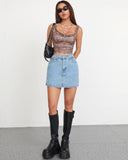 Model wearing Flvsun-Denim Skorts high waisted denim mini skort with side slit, styled with stylish top and boots.