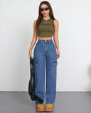 Woman in high waist baggy cargo jeans and crop top, showcasing a stylish relaxed fit with pockets.